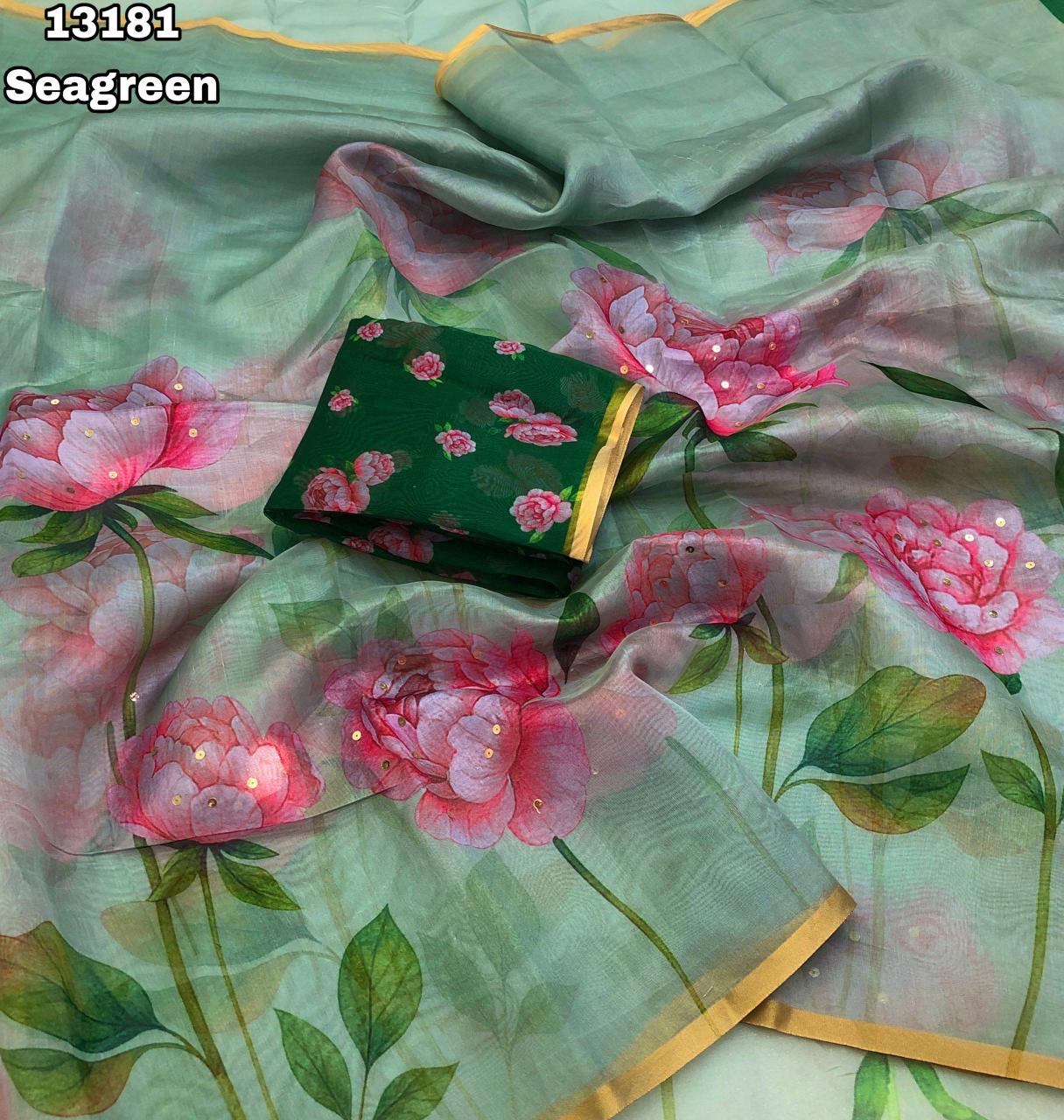 Mint Green Organza Saree with Pink Floral Digital Print and Gold Zari Border.
